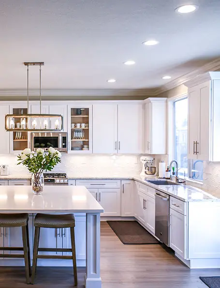 A luxurious kitchen with white cabinets